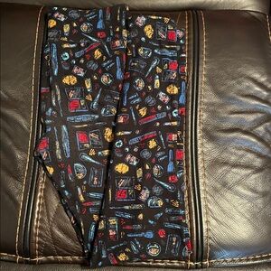 LulaRoe One Size Makeup leggings, black background, fits 2-10